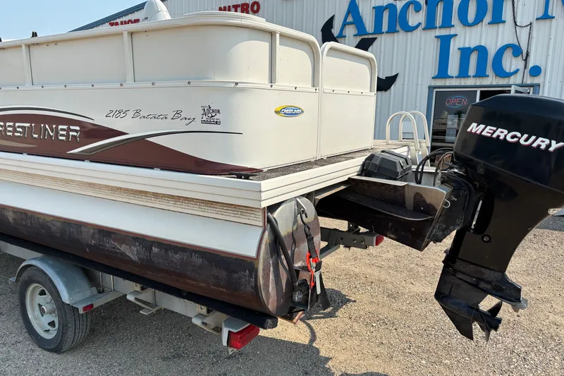 Slide: The Image of 2008 Crestliner Batata Bay 2185 boat with Mercury outboard motor, parked outside Anchor Inc. - 9