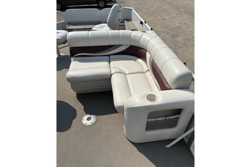 Slide: The Image of 2008 Crestliner Batata Bay 2185 boat interior with white and maroon seating arrangement. - 12