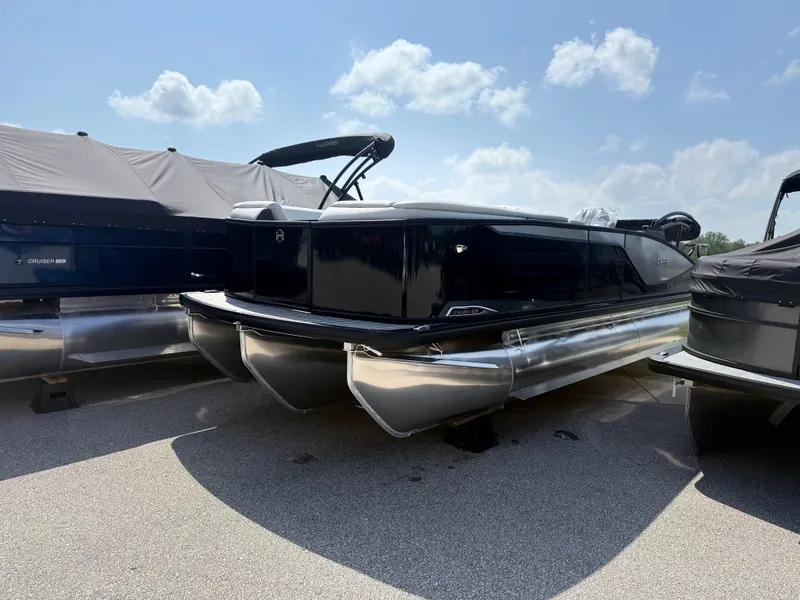 The Image of A 2027 Harris FloteBote SUNLINER 230 TRI-TOON SLDH is parked. It features a sleek black design with three aluminum pontoons. - 1