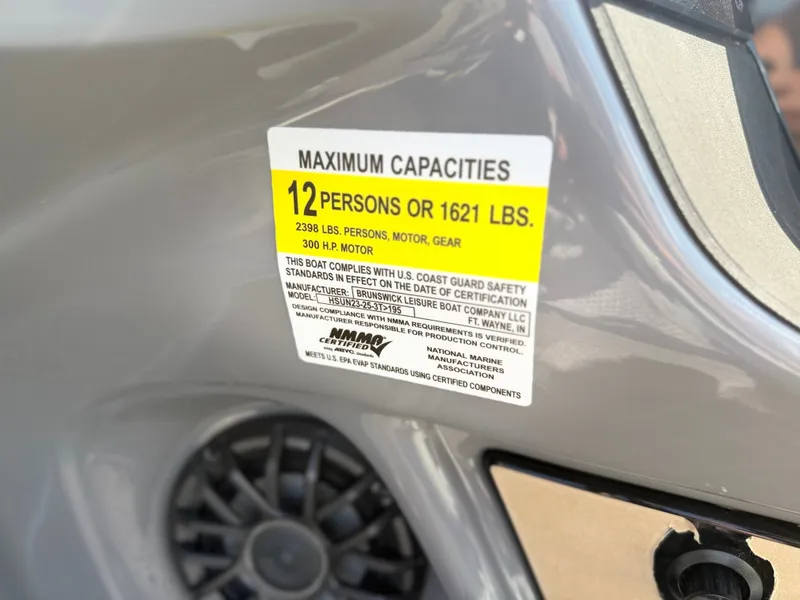 Slide: The Image of A sign on a boat shows the maximum capacity of 12 persons or 1621 pounds. - 9