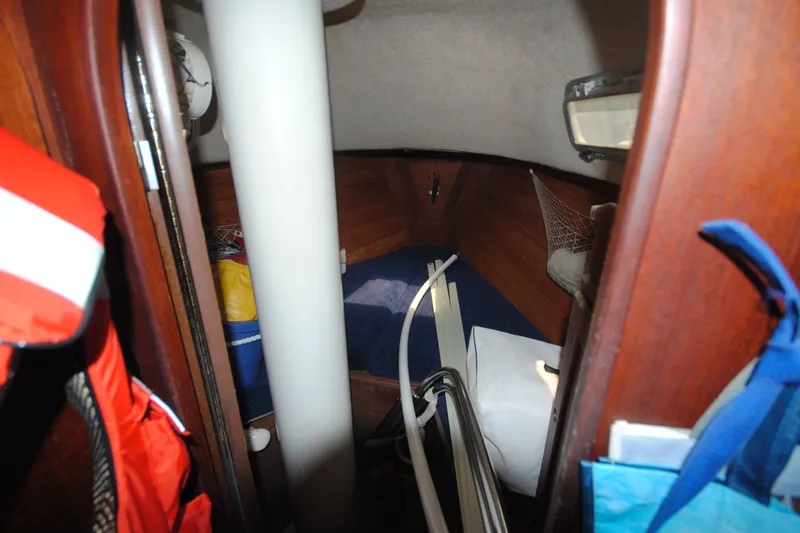 Slide: The Image of Interior cabin of a 1987 Tillotson-Pearson 28 sailboat with storage and equipment. - 18