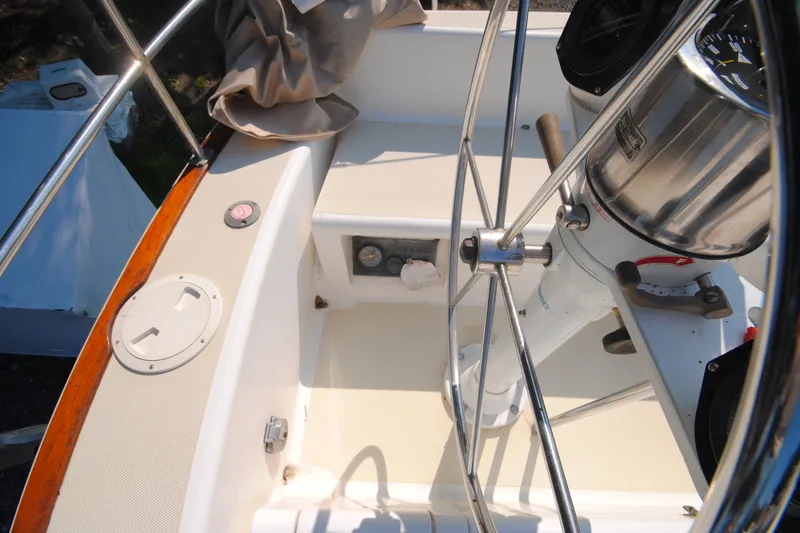 Slide: The Image of Cockpit of 1987 Tillotson-Pearson 28 sailboat with steering wheel and navigation instruments. - 10