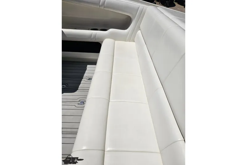 Slide: The Image of White leather seating on 2001 Advantage 34 Offshore boat, showcasing sleek design and comfort. - 45
