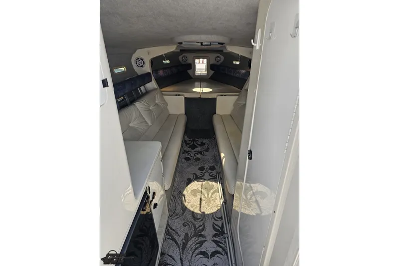 Slide: The Image of Interior of 2001 Advantage 34 Offshore boat with seating and patterned carpet. - 63