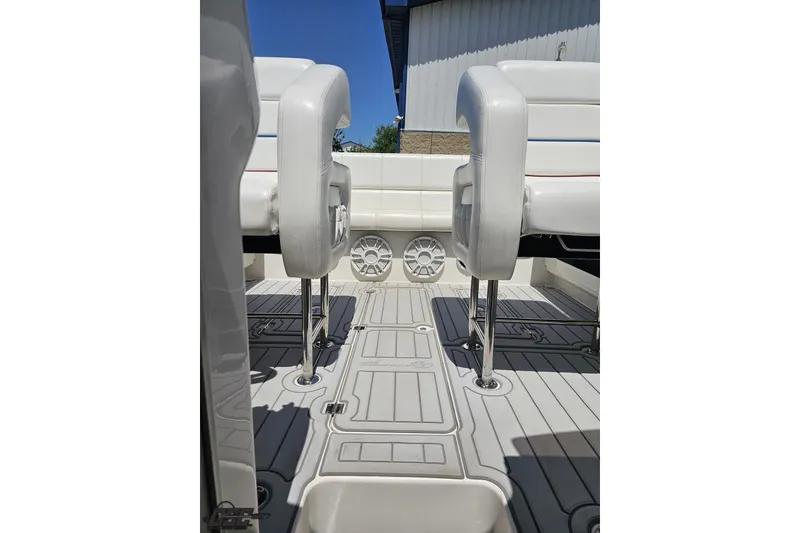 Slide: The Image of 2001 Advantage 34 Offshore boat interior with white seating and sleek flooring. - 74