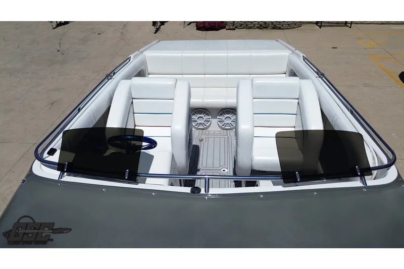 Slide: The Image of 2001 Advantage 34 Offshore boat interior with white seating and dual windshields. - 33