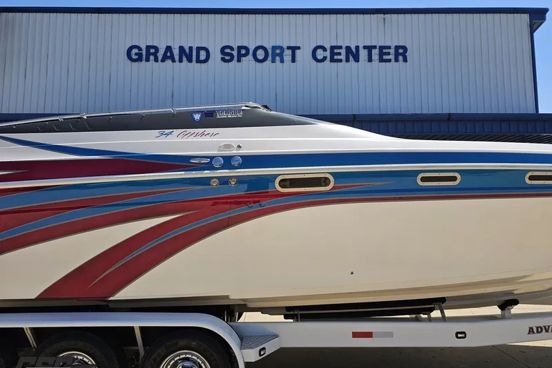 Slide: The Image of 2001 Advantage 34 Offshore boat with colorful design at Grand Sport Center. - 4