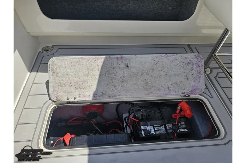 Slide: The Image of Open battery compartment of 2001 Advantage 34 Offshore boat, showing wiring and connections. - 81