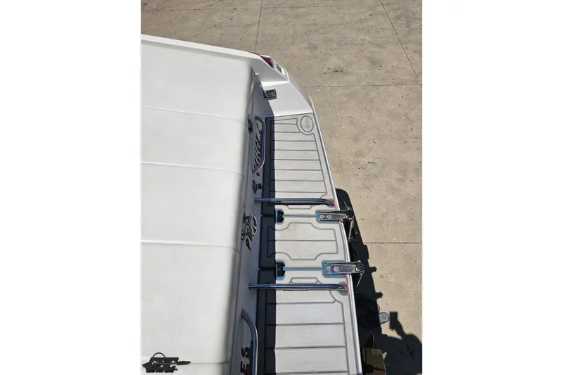 Slide: The Image of Rear view of a 2001 Advantage 34 Offshore boat on a concrete surface. - 35