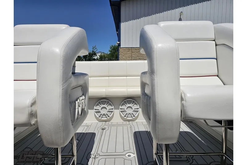 Slide: The Image of 2001 Advantage 34 Offshore boat interior with white seating and speaker system. - 75