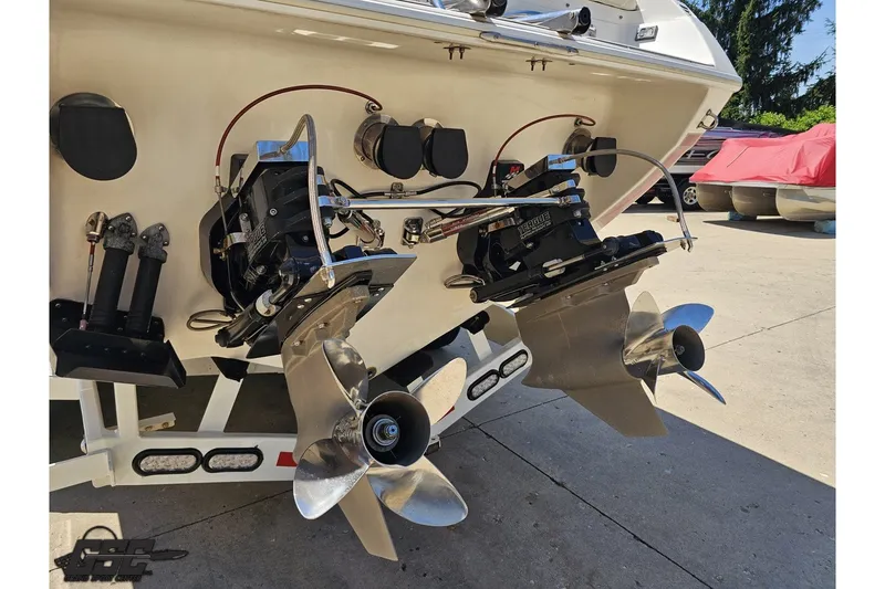 Slide: The Image of Rear view of a 2001 Advantage 34 Offshore boat showing dual propellers and outboard motors. - 27