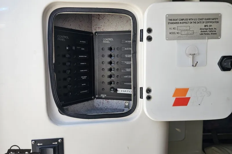 Slide: The Image of Control panel of a 2001 Advantage 34 Offshore boat with safety compliance details. - 72