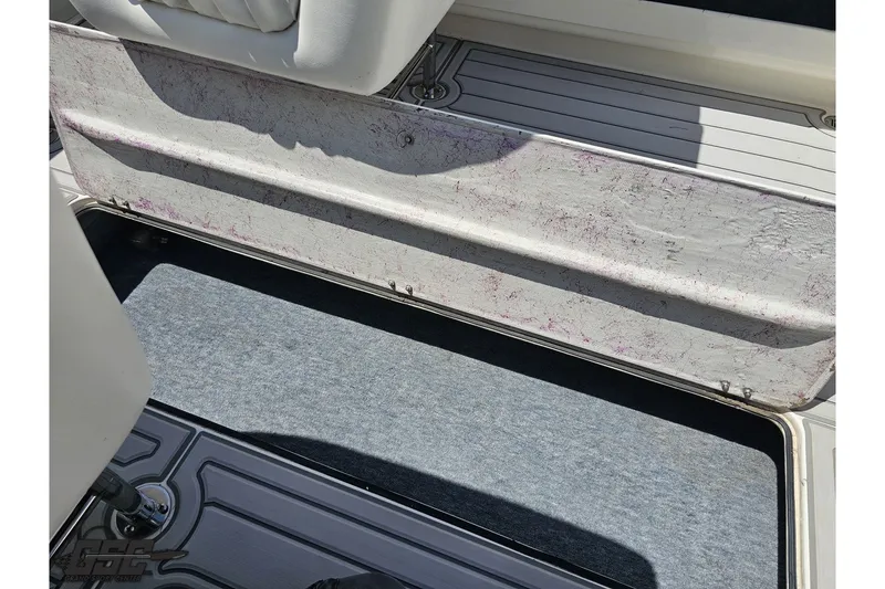 Slide: The Image of Storage compartment on 2001 Advantage 34 Offshore boat, featuring textured interior and carpeted flooring. - 82