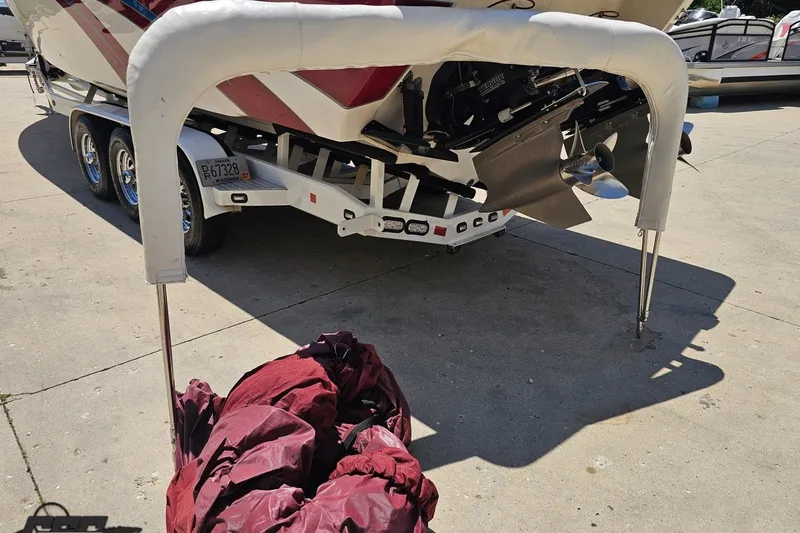 Slide: The Image of 2001 Advantage 34 Offshore boat on trailer, with propeller and red cover visible. - 94
