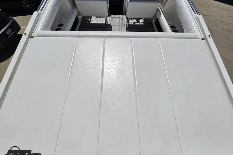Slide: The Image of 2001 Advantage 34 Offshore boat interior with white seating and deck. - 38