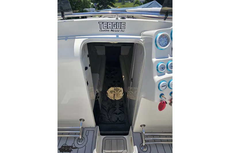 Slide: The Image of 2001 Advantage 34 Offshore boat interior with Teague Custom Marine dashboard and gauges. - 62