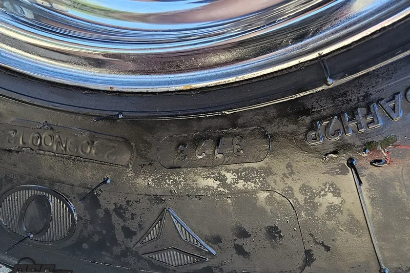 Slide: The Image of Close-up of a tire with visible tread and markings, Advantage 34 Offshore 2001. - 95