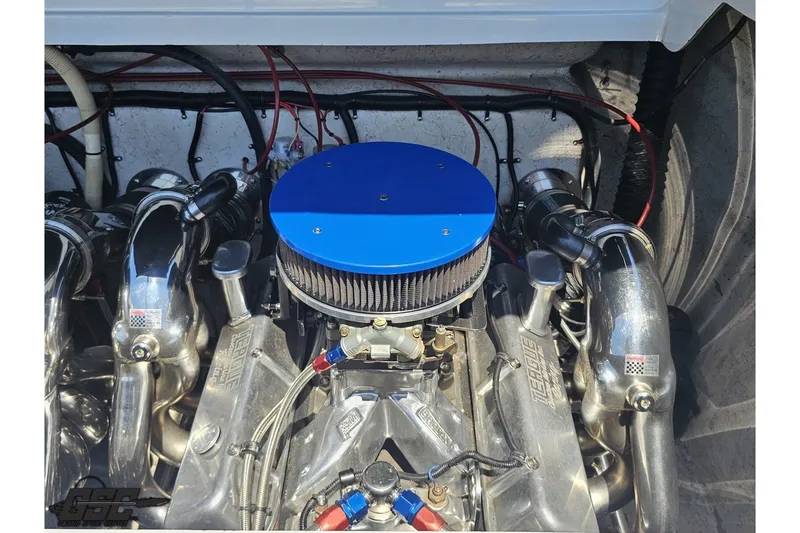 Slide: The Image of Engine compartment of a 2001 Advantage 34 Offshore boat with a blue air filter. - 87