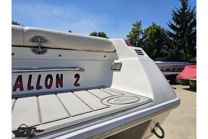 Slide: The Image of 2001 Advantage 34 Offshore boat stern view with custom lettering and sunny backdrop. - 29
