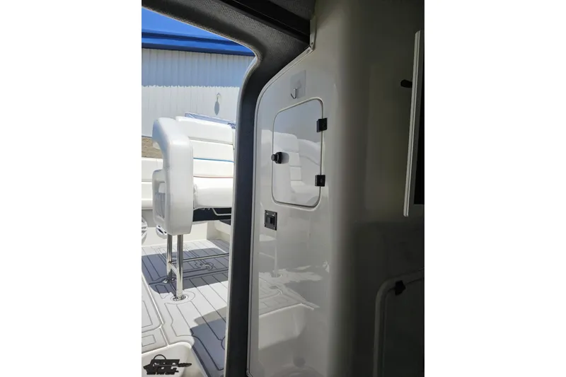 Slide: The Image of Interior view of a 2001 Advantage 34 Offshore boat, featuring white seating and sleek design. - 71