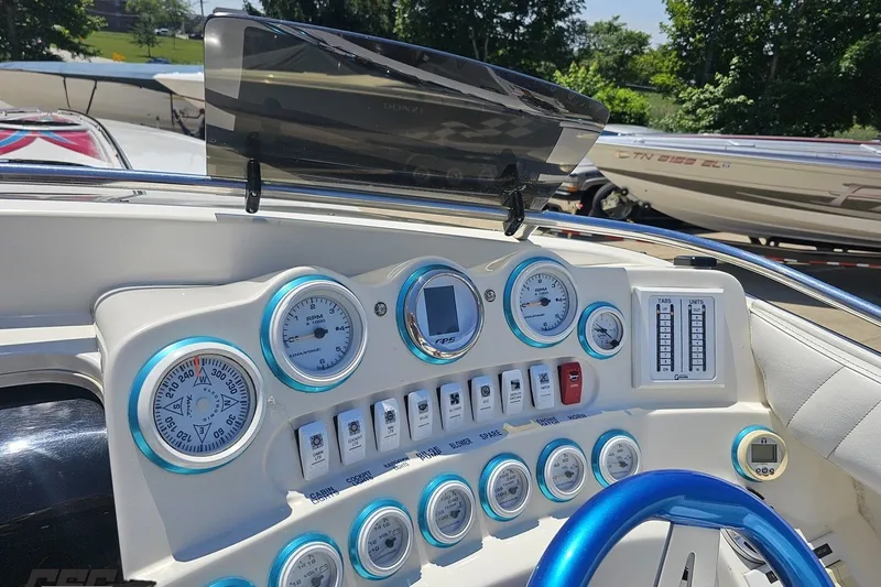 Slide: The Image of Dashboard of a 2001 Advantage 34 Offshore boat with gauges and controls. - 58