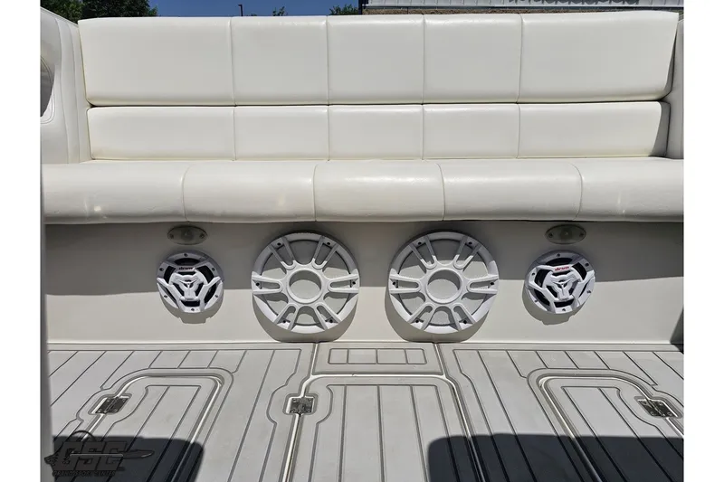 Slide: The Image of White leather seating and speakers on a 2001 Advantage 34 Offshore boat. - 80