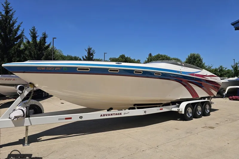 Slide: The Image of 2001 Advantage 34 Offshore boat on trailer, featuring sleek design and vibrant graphics. - 16