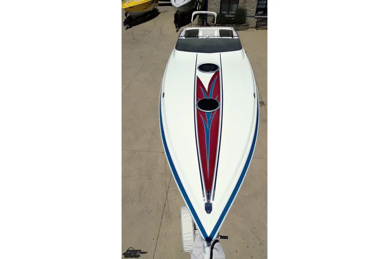 Slide: The Image of 2001 Advantage 34 Offshore boat with sleek design and vibrant red-blue graphics. - 31