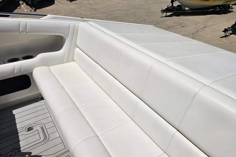 Slide: The Image of White leather seating on a 2001 Advantage 34 Offshore boat, showcasing luxury and comfort. - 46