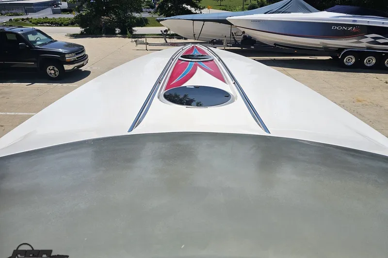 Slide: The Image of 2001 Advantage 34 Offshore boat with sleek design and vibrant graphics. - 61