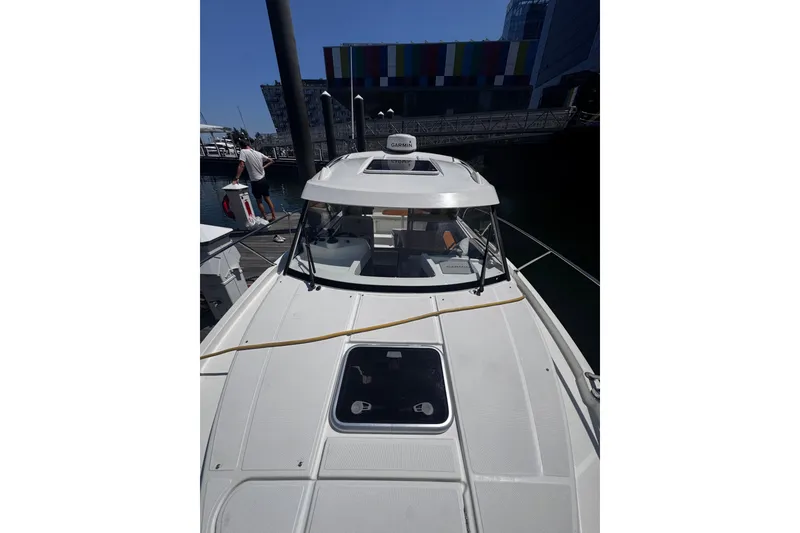 Slide: The Image of 2021 Beneteau Antares 8 docked at marina, showcasing sleek design and modern features. - 28