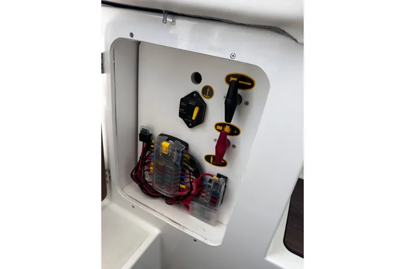 Slide: The Image of Electrical panel of a 2021 Beneteau Antares 8 boat, featuring switches and wiring. - 33