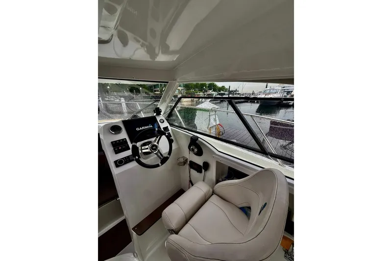 Slide: The Image of Interior view of 2021 Beneteau Antares 8 boat cockpit with Garmin navigation system. - 3