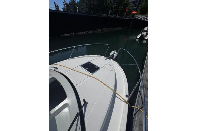Slide: The Image of Beneteau Antares 8 boat docked, 2021 model, viewed from the bow. - 25