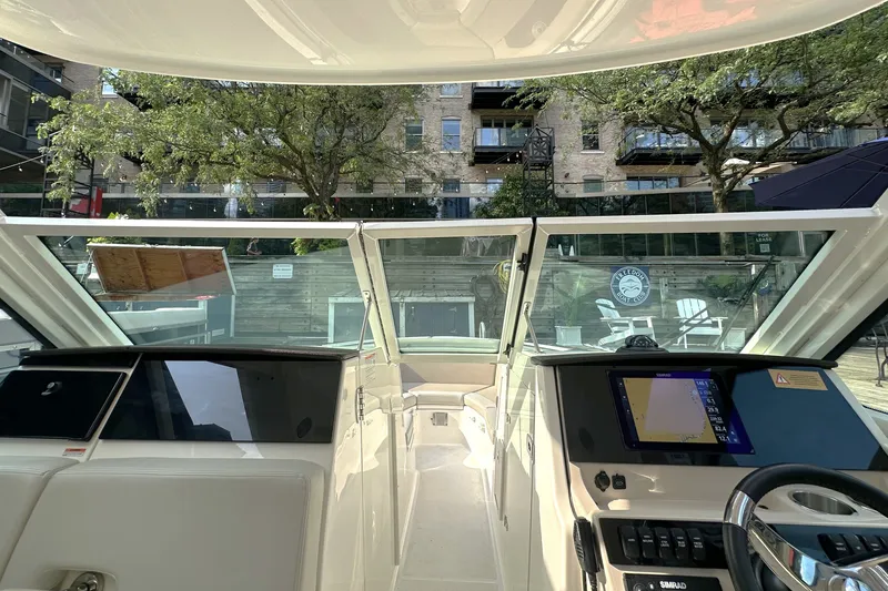 Slide: The Image of Interior view of 2025 Boston Whaler 280 Vantage boat with modern dashboard and controls. - 5