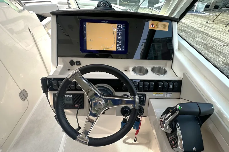 Slide: The Image of 2025 Boston Whaler 280 Vantage helm with Simrad display and modern controls. - 6