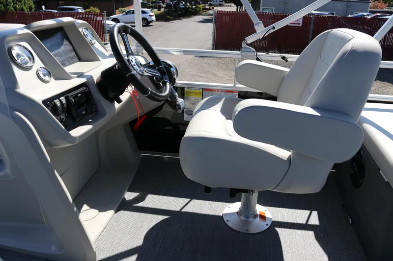 Slide: The Image of 2025 SunChaser Vista 20 Fish boat interior with steering console and captain's chair. - 14