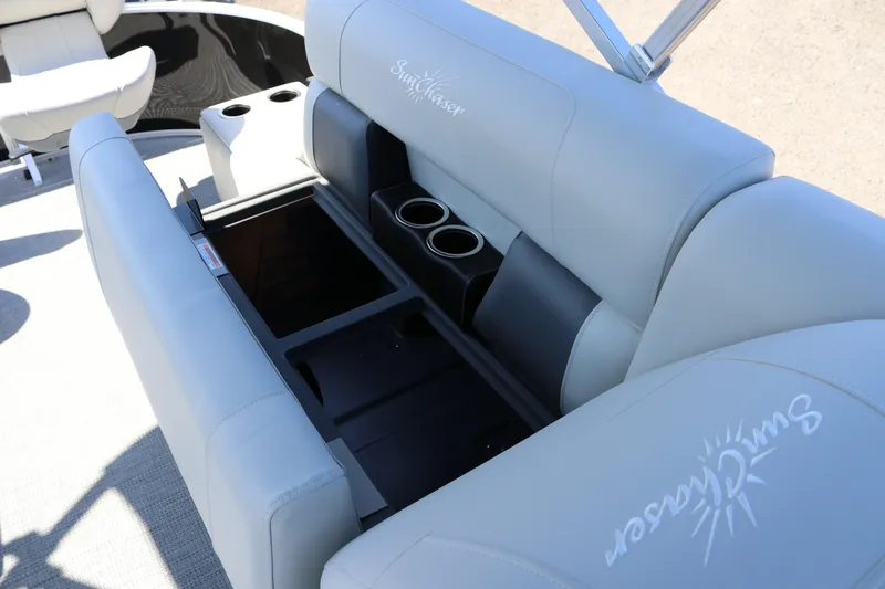 Slide: The Image of 2025 SunChaser Vista 20 Fish boat interior with storage and cup holders. - 25