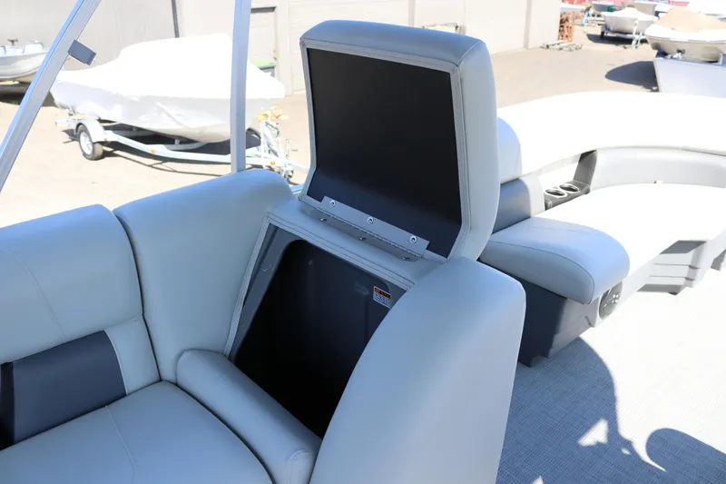 Slide: The Image of SunChaser Vista 20 Fish 2025 boat interior with open storage compartment. - 23