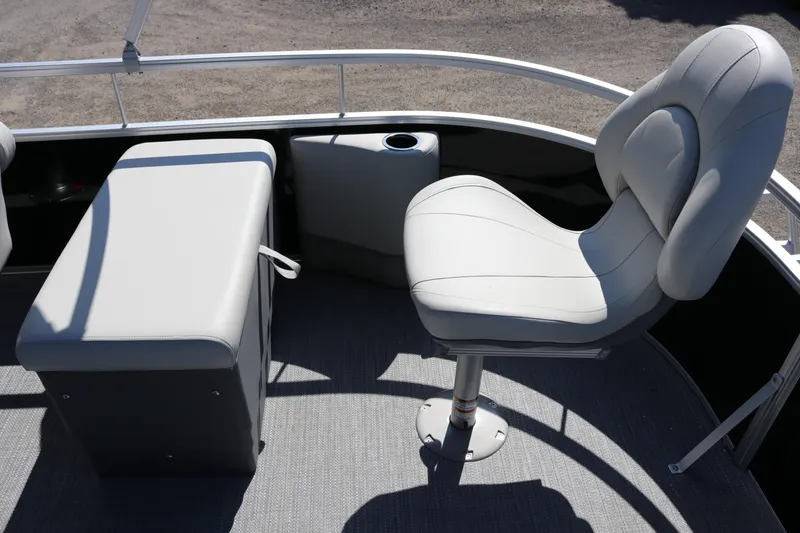 Slide: The Image of 2025 SunChaser Vista 20 Fish boat interior with cushioned seating and cup holder. - 10