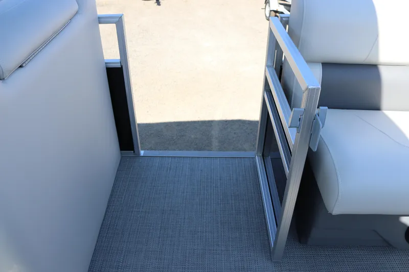 Slide: The Image of Interior view of 2025 SunChaser Vista 20 Fish pontoon boat with seating and open gate. - 20