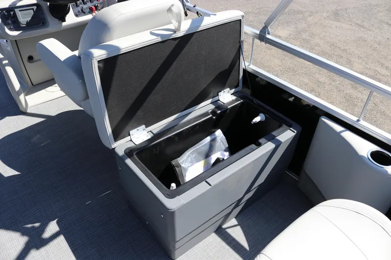 Slide: The Image of Open storage compartment on 2025 SunChaser Vista 20 Fish boat interior. - 11