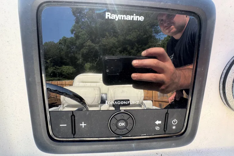 Slide: The Image of Raymarine Dragonfly-7 display on 2016 Sea Hunt Triton 188 boat, reflecting a person taking a photo. - 6