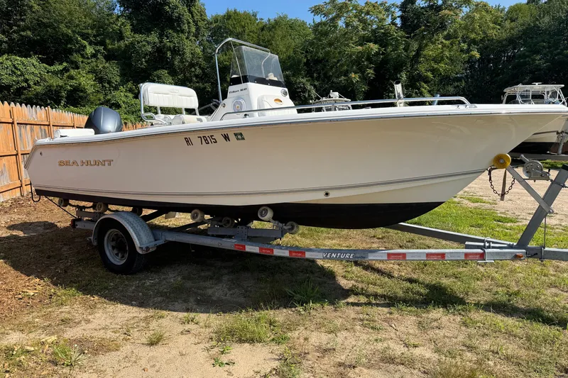 Slide: The Image of 2016 Sea Hunt Triton 188 boat on trailer, parked outdoors. - 2