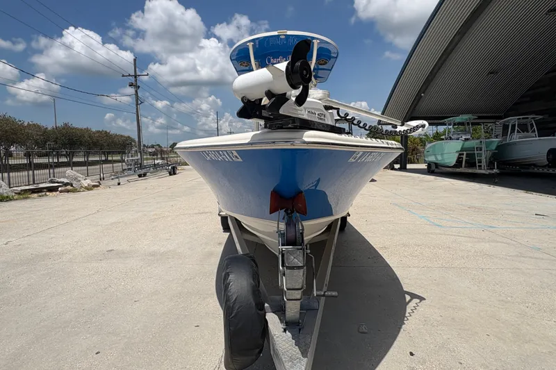 Slide: The Image of 2019 Sea Chaser 26 LX boat on trailer, parked outdoors under a cloudy sky. - 8
