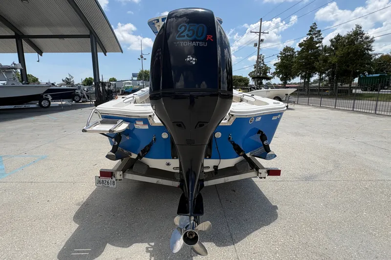 Slide: The Image of 2019 Sea Chaser 26 LX boat with Tohatsu 250R engine, parked outdoors. - 4