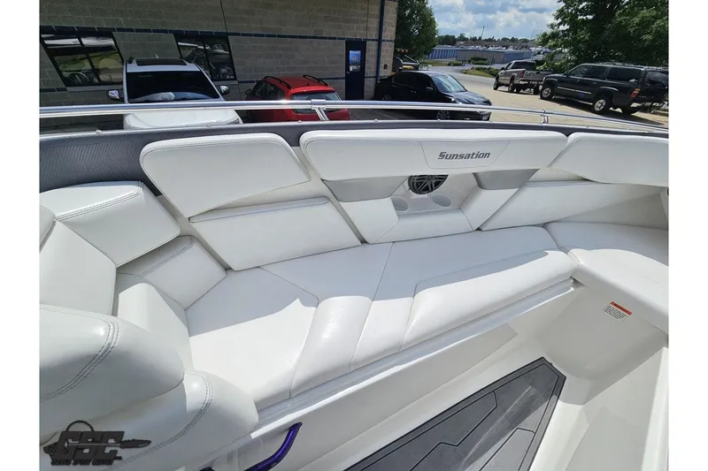 Slide: The Image of 2007 Sunsation 32 Dominator boat interior with white seating and sleek design. - 80