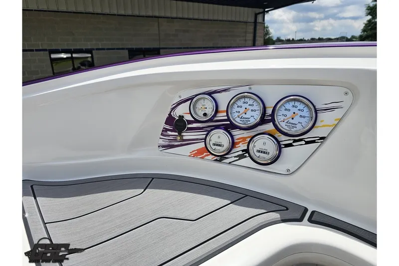 Slide: The Image of Dashboard of a 2007 Sunsation 32 Dominator boat with colorful gauge panel. - 51