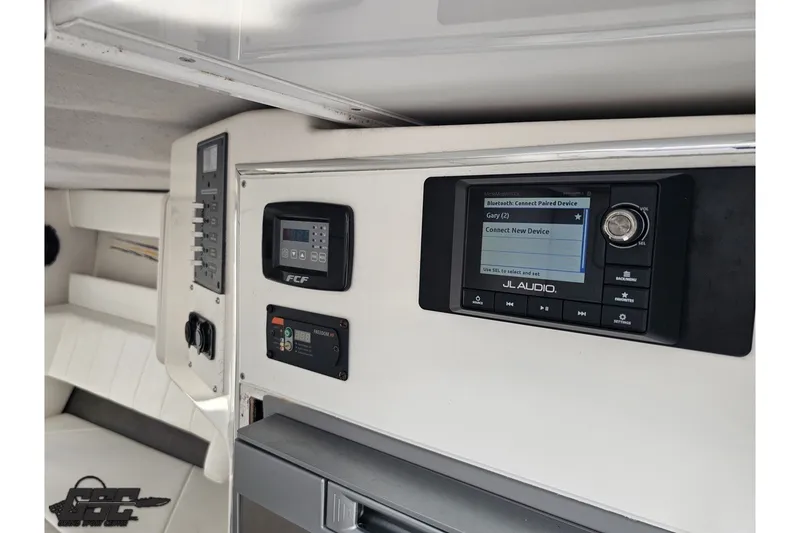 Slide: The Image of Interior of 2007 Sunsation 32 Dominator with JL Audio system and control panels. - 69