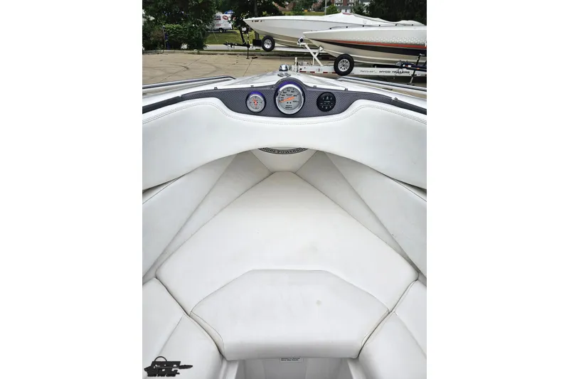 Slide: The Image of 2007 Sunsation 32 Dominator boat interior with white seating and dashboard gauges. - 83